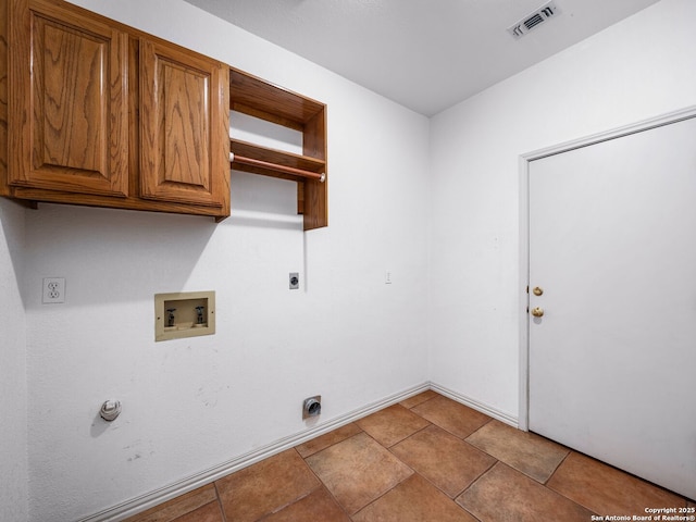 laundry room with cabinets, washer hookup, and electric dryer hookup