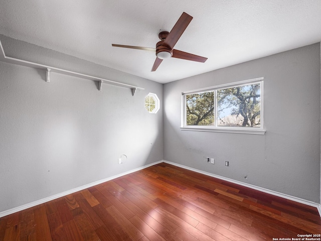 unfurnished room with hardwood / wood-style floors and ceiling fan