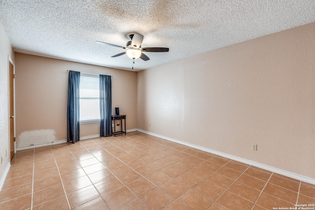 unfurnished room with light tile patterned floors, a textured ceiling, and ceiling fan