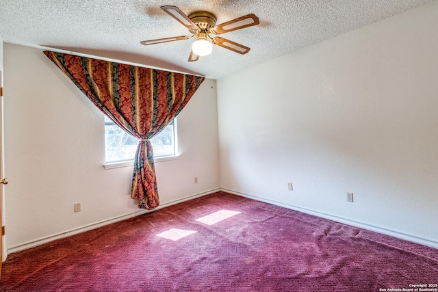 carpeted spare room with ceiling fan and a textured ceiling