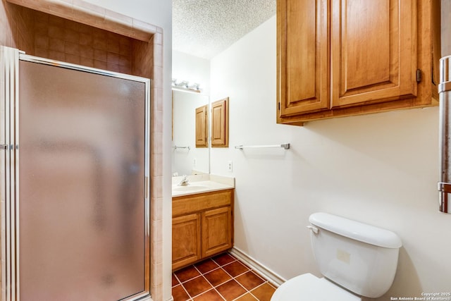 bathroom with tile patterned floors, an enclosed shower, a textured ceiling, and vanity