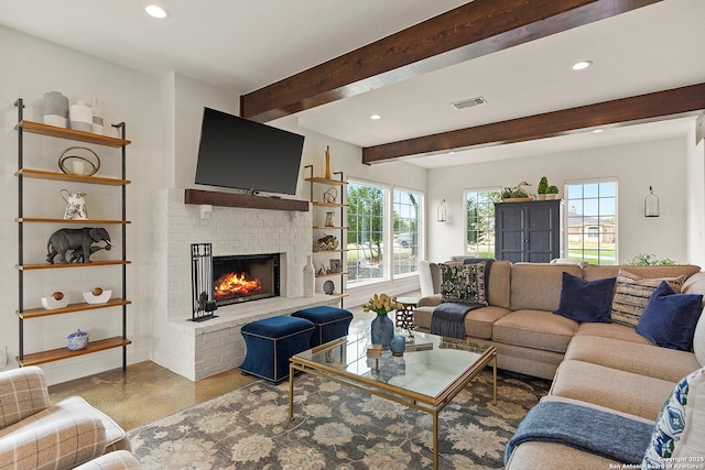 living area with a fireplace, recessed lighting, finished concrete floors, and beamed ceiling