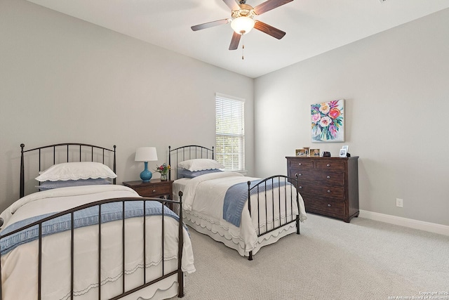 bedroom featuring carpet flooring, baseboards, and a ceiling fan