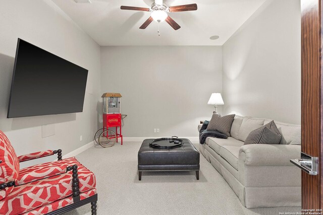 living room featuring a ceiling fan, carpet floors, and baseboards