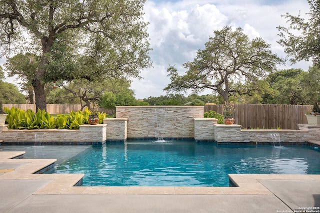 view of swimming pool featuring a fenced backyard