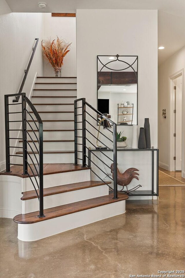 stairway with baseboards