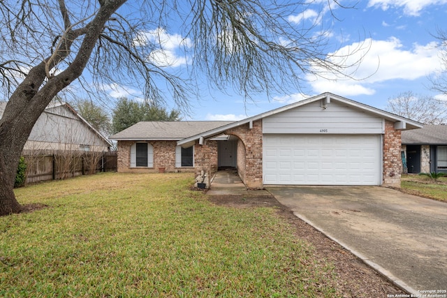 ranch-style home featuring a garage and a front yard