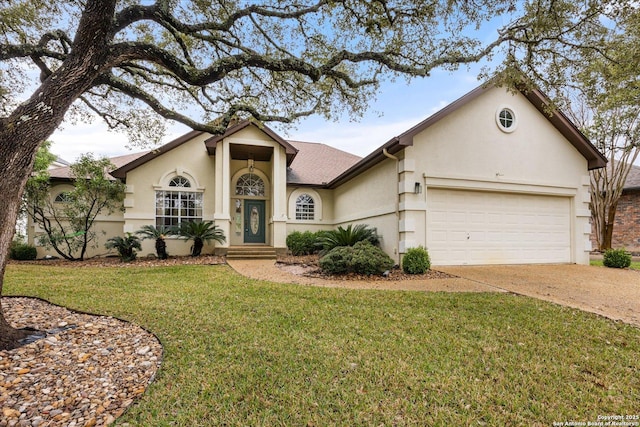 ranch-style house featuring a garage and a front lawn