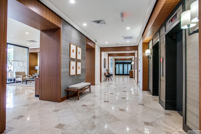 hallway featuring ornamental molding