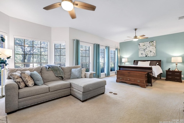 bedroom featuring light carpet and ceiling fan