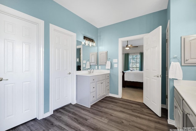 bathroom with vanity, hardwood / wood-style floors, and ceiling fan