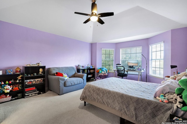 carpeted bedroom featuring multiple windows, lofted ceiling, and ceiling fan