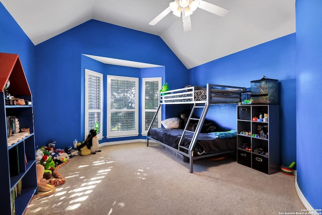 carpeted bedroom featuring lofted ceiling and ceiling fan