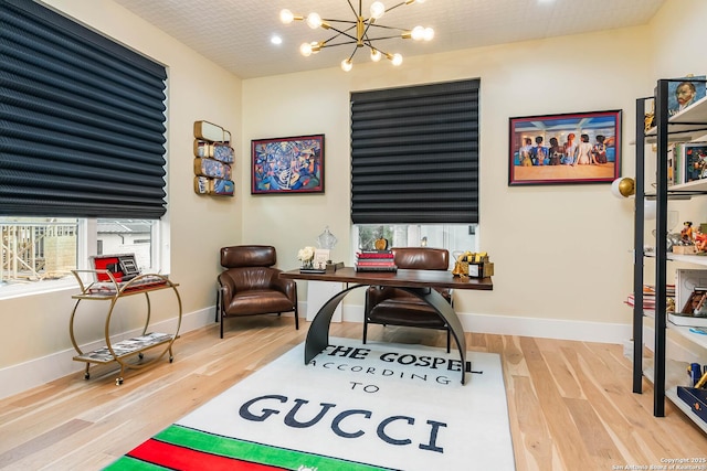 office with an inviting chandelier and wood-type flooring