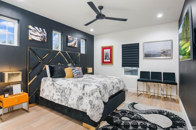 bedroom featuring wood-type flooring and ceiling fan