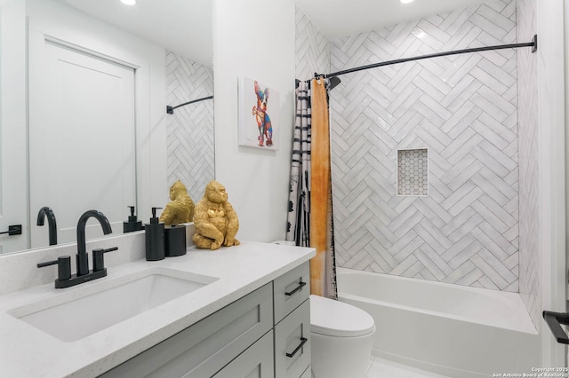 full bathroom featuring vanity, shower / bath combination with curtain, and toilet