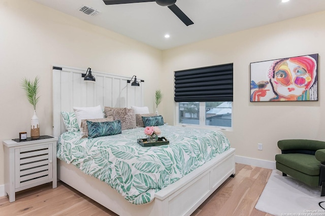 bedroom with ceiling fan and light hardwood / wood-style flooring