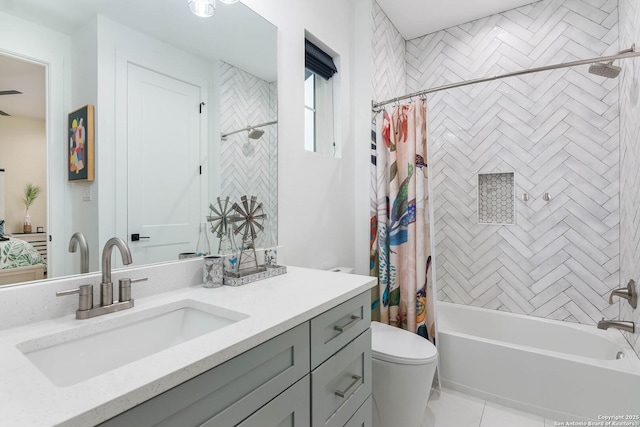 full bathroom with vanity, tile patterned flooring, toilet, and shower / bath combo with shower curtain