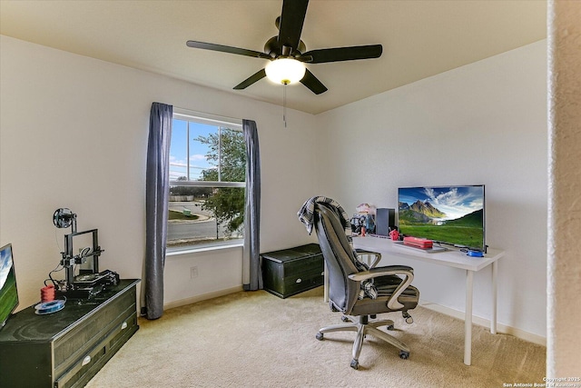 office space featuring light colored carpet and ceiling fan