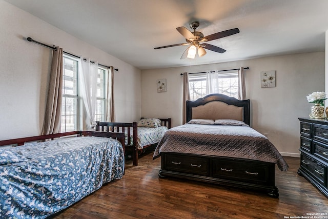 bedroom with ceiling fan and dark hardwood / wood-style flooring