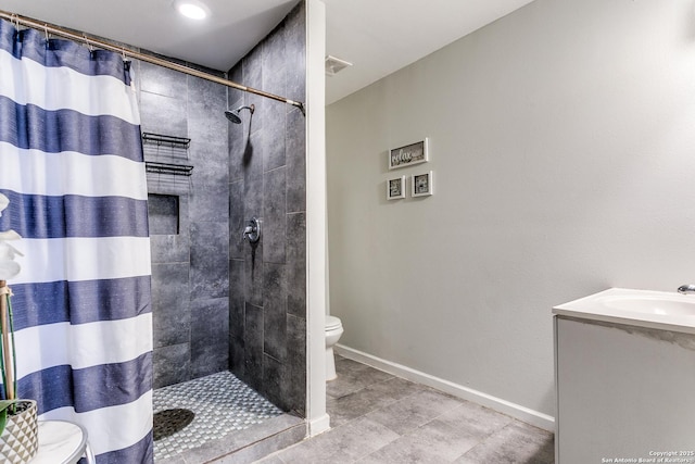 bathroom with vanity, toilet, and a shower with shower curtain