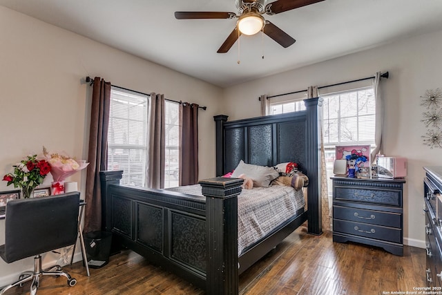 bedroom featuring ceiling fan and dark hardwood / wood-style floors