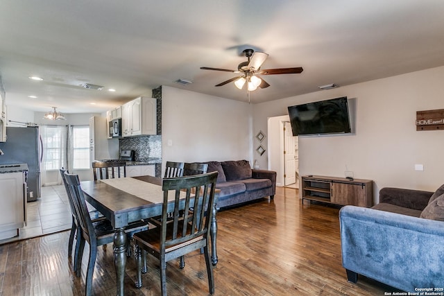 dining room featuring dark wood-type flooring and ceiling fan