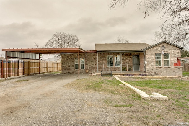 view of front facade featuring a carport and a porch