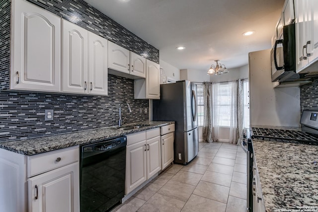 kitchen featuring white cabinetry, sink, black appliances, and dark stone countertops