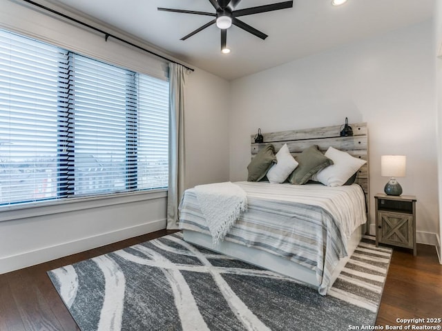 bedroom featuring dark wood-type flooring and ceiling fan