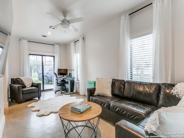 living room featuring ceiling fan