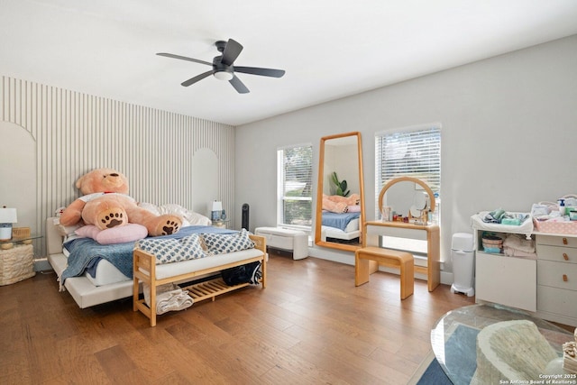 bedroom featuring hardwood / wood-style floors and ceiling fan