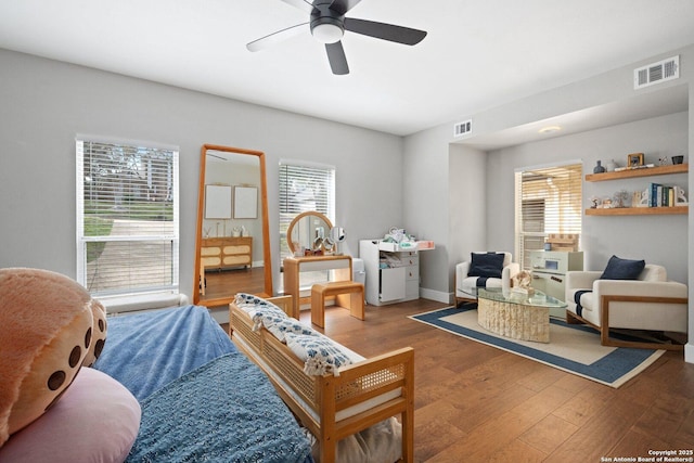 sitting room featuring hardwood / wood-style flooring, plenty of natural light, and ceiling fan