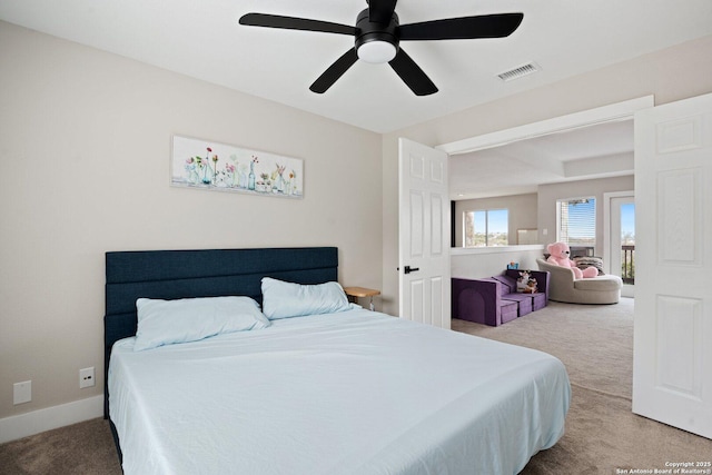 carpeted bedroom featuring ceiling fan