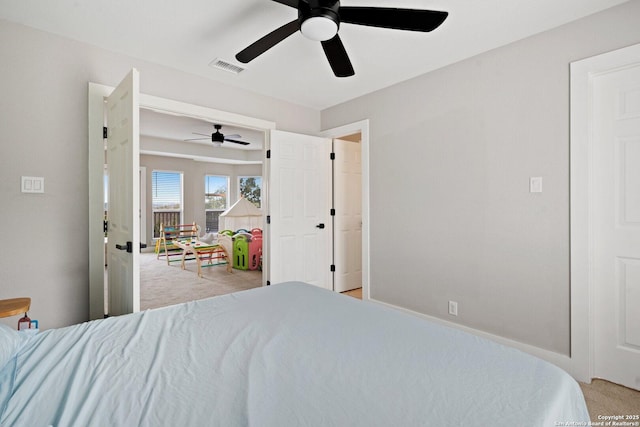 bedroom featuring light colored carpet and ceiling fan