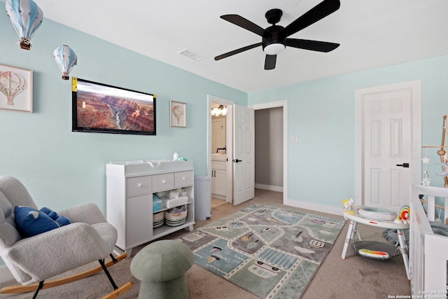 living area featuring ceiling fan and light colored carpet