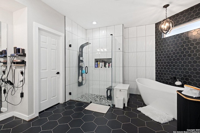 bathroom featuring separate shower and tub, tile patterned flooring, and tile walls