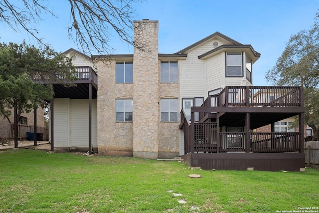 back of house with a yard and a deck