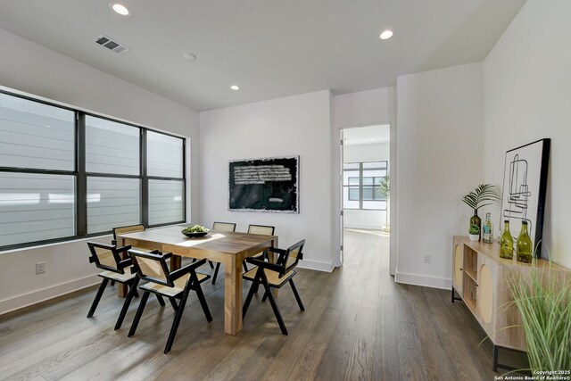 dining space featuring dark hardwood / wood-style floors