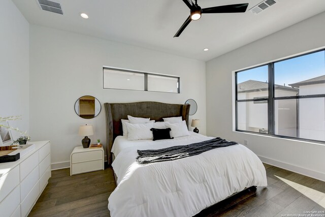 bedroom featuring dark hardwood / wood-style floors and ceiling fan