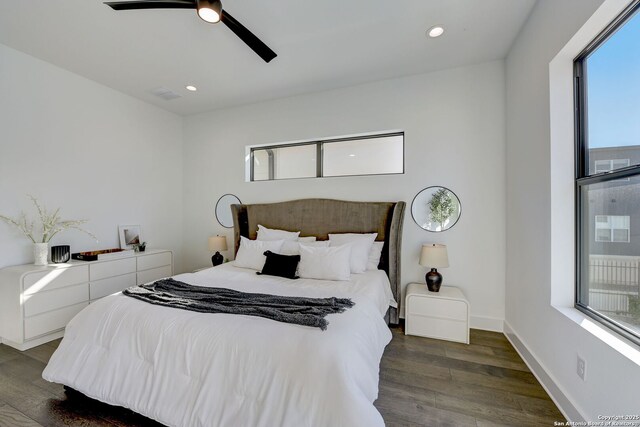 bedroom featuring ceiling fan and dark hardwood / wood-style flooring