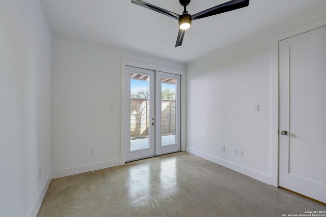 unfurnished room featuring ceiling fan and french doors