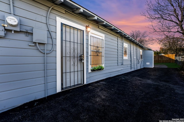 view of property exterior at dusk