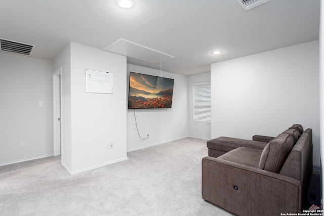 sitting room featuring light carpet