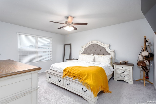 bedroom with light colored carpet and ceiling fan