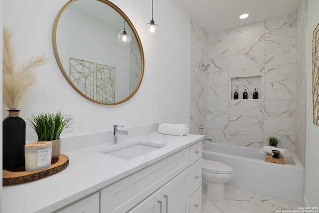 full bathroom featuring vanity, tiled shower / bath, and toilet