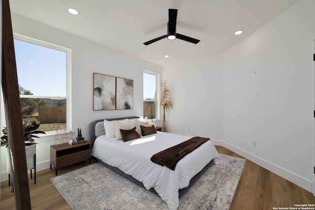 bedroom with wood-type flooring and ceiling fan