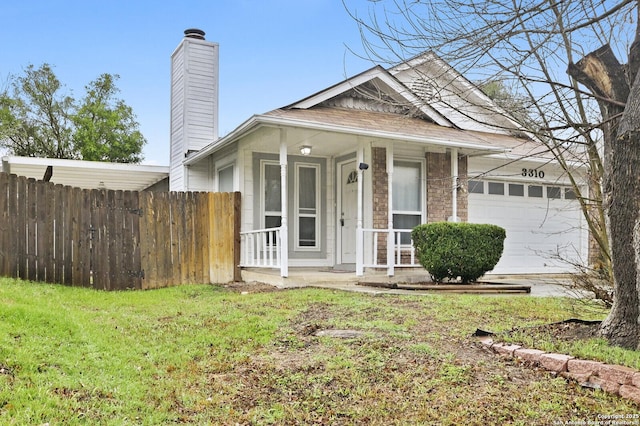 view of front of property featuring a garage and a front yard