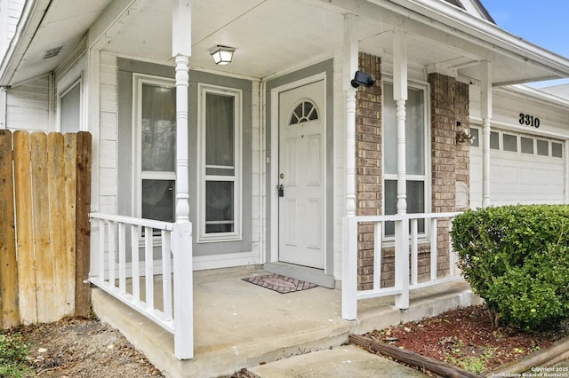 view of exterior entry with a garage