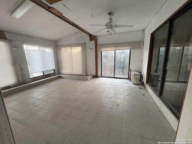 unfurnished room with lofted ceiling with beams and ceiling fan